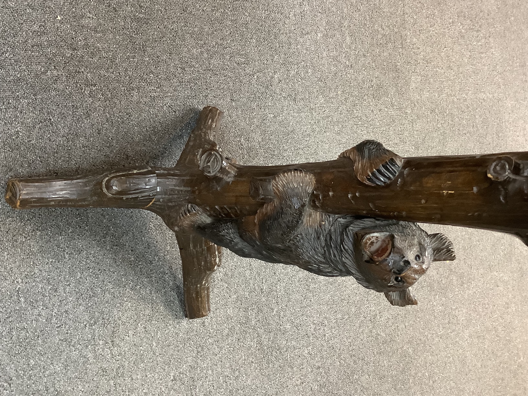 An early 20th century Black Forest musical smoker's stand, height 86cm, with musical movement